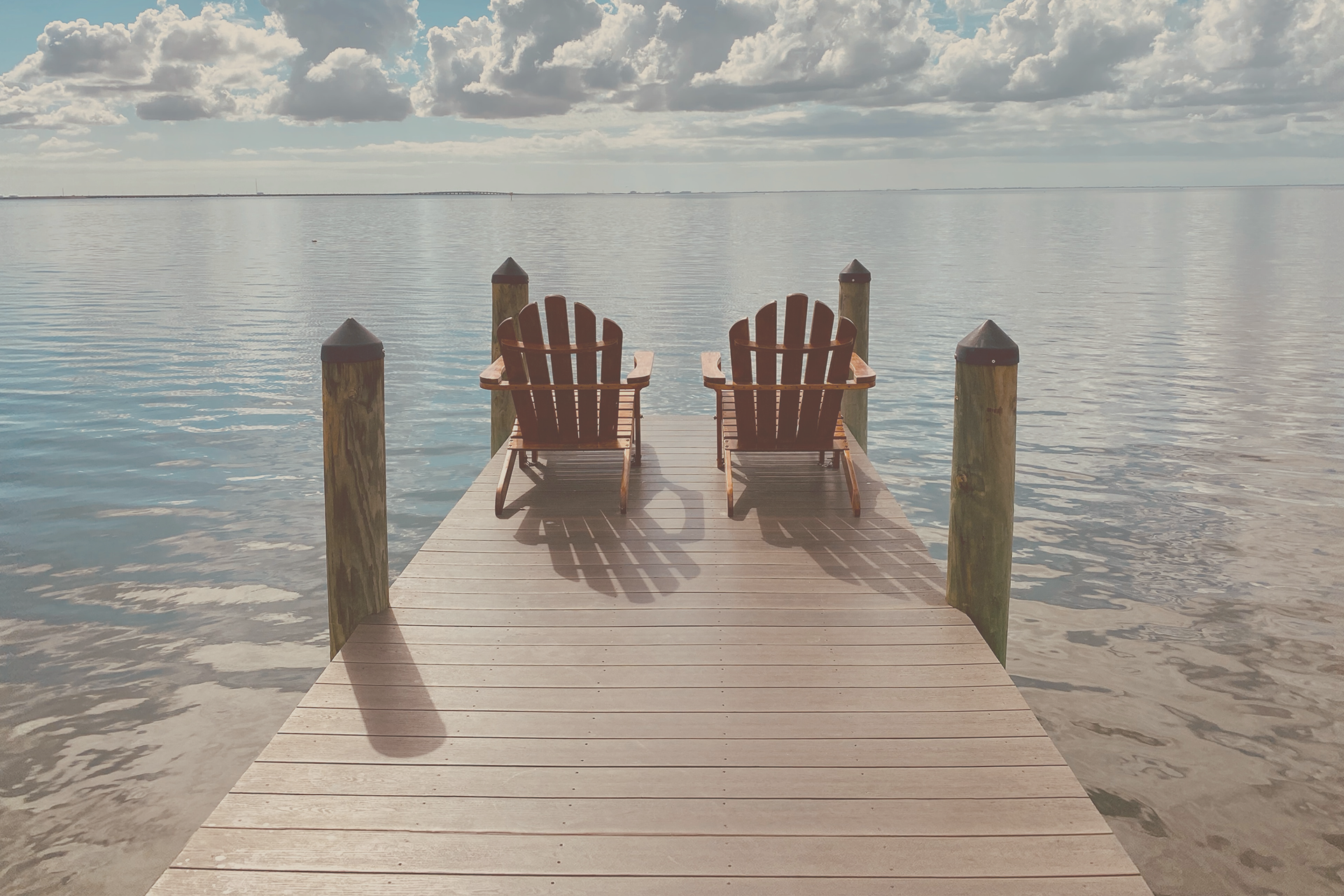 two chairs on a dock