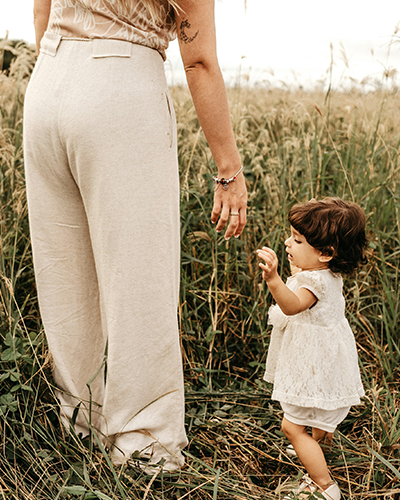 Mom holding babies hand